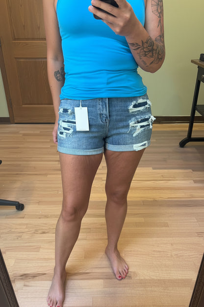 VERVET by Flying Monkey High Rise Patched Double Cuffed Denim Shorts showing distressed and patched detail, side view