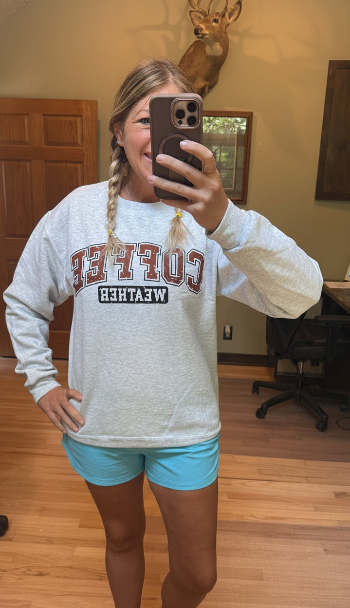Bob & Keek Coffee Weather Sweatshirt in Ash Grey worn with light blue shorts — relaxed fit crewneck with Coffee Weather graphic