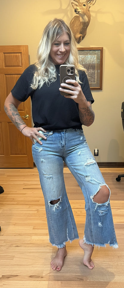Brooke wearing Blakeley Drew distressed wide leg dad jeans in light wash size 1, front view showing heavy distressing and wide leg opening

