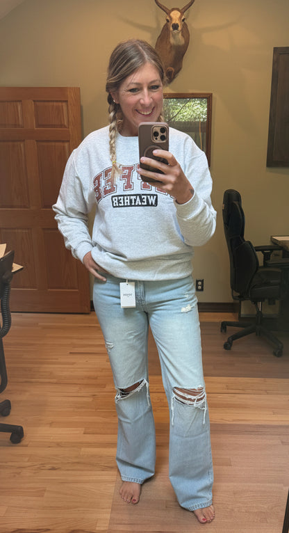 Brooke wearing VERVET by Flying Monkey 90's Vintage Super High Rise Flare Jeans in Sunny Plains, size 27 — front view showing knee distressing and flare leg